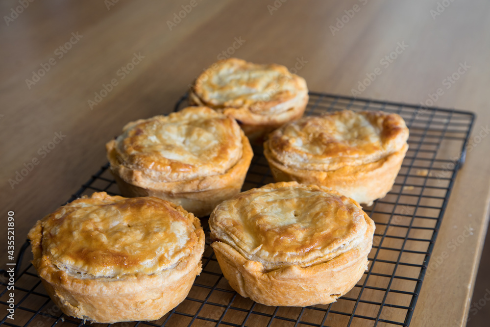 Home made meat pies on backing rack