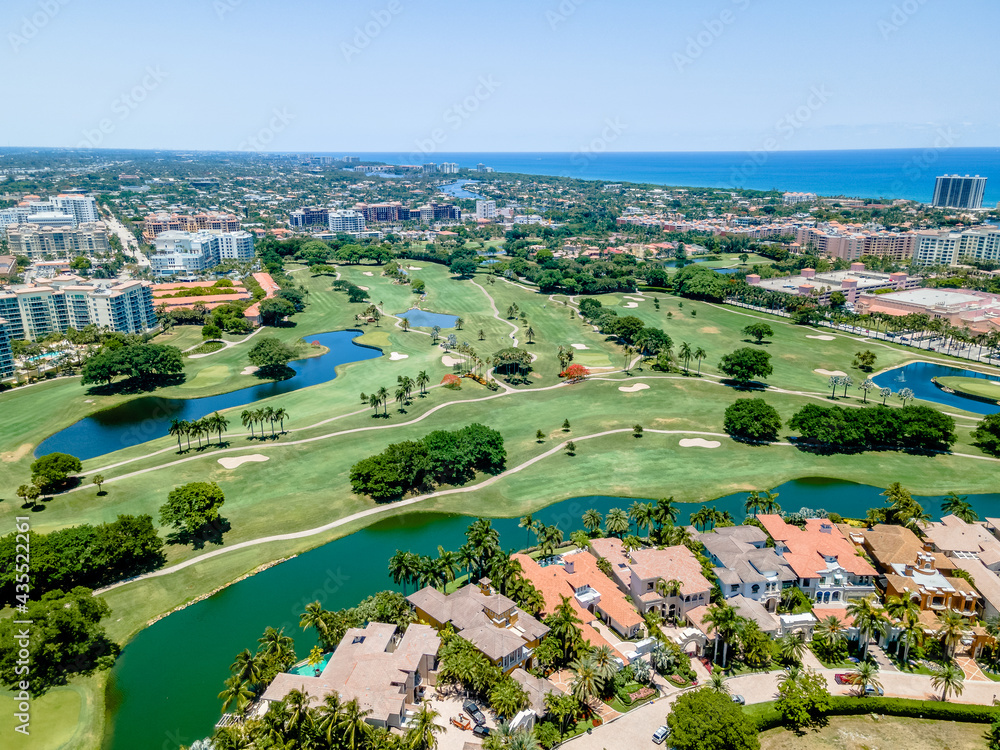 aerial drone of Golf course in Boca Raton, Florida with city