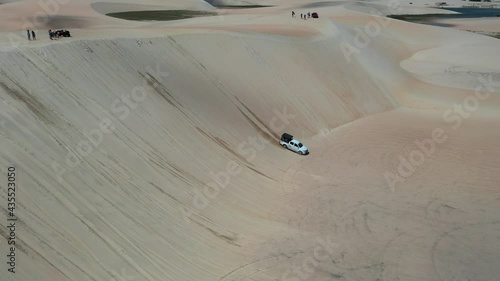 Tropical view of sand dunes, Jericoacoara, Ceara, Brazil.Cars scene.Tropical view of sand dunes, Jericoacoara, Ceara, Brazil.Cars scene.Tropical view of sand dunes, Jericoacoara, Ceara, Brazil.Cars sc photo