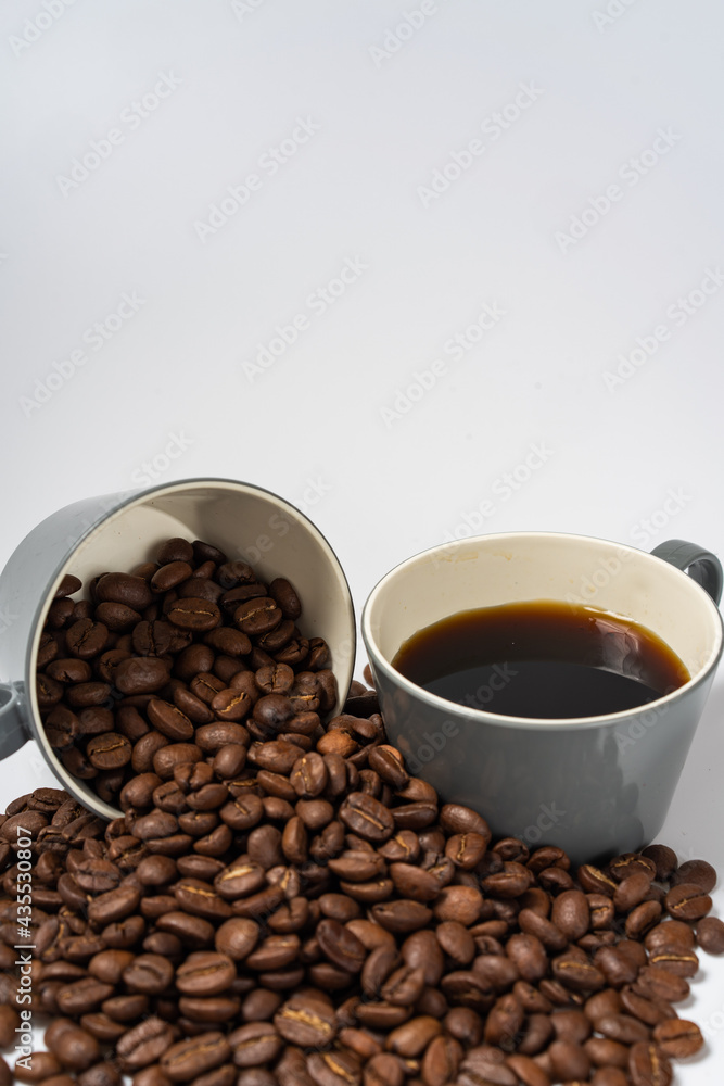 Fototapeta premium Coffee beans and coffee on a white background