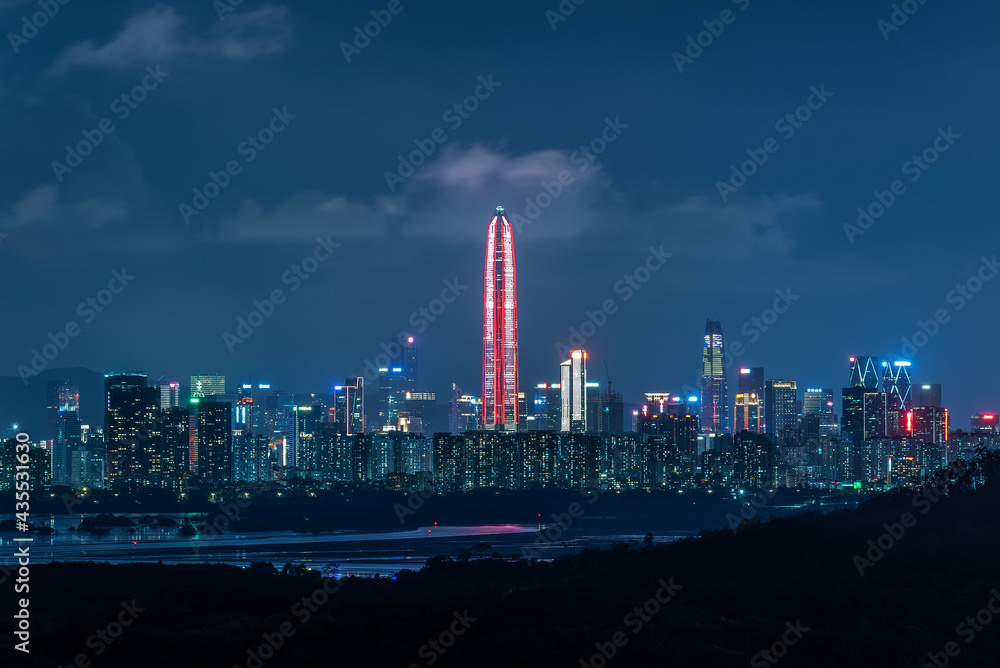Skyline of downtown district of Shenzhen city, China at night. Viewed from Hong Kong border