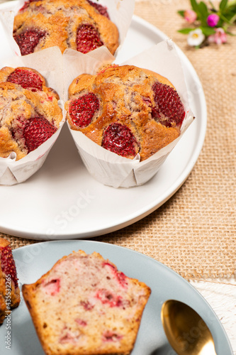 Homemade baked muffins with delicious fresh strawberries