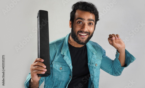 Image of man with sound bar he is happy and dancing © FireFXStudio