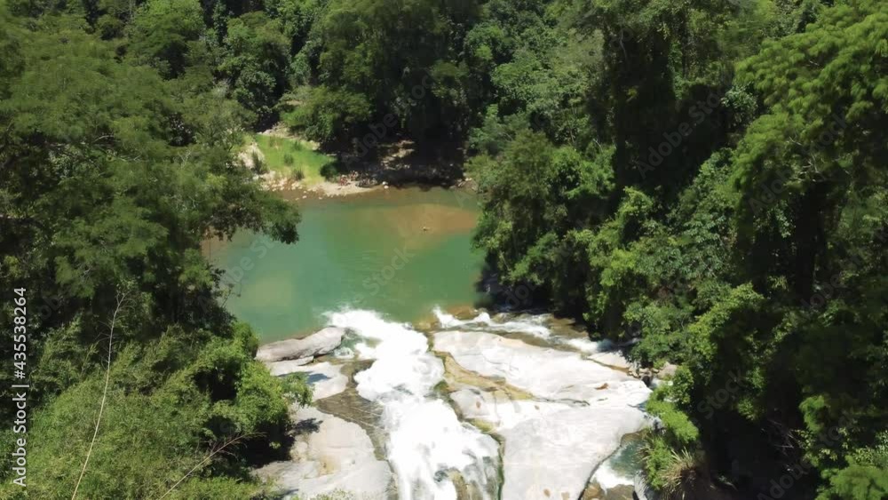 waterfall in Brazil in Rio. Waterfall slide in rainforest. smooth revealing shot with drone in 4k. waterfall in Brazil in Rio. Waterfall slide in rainforest. smooth revealing shot with drone in 4k.