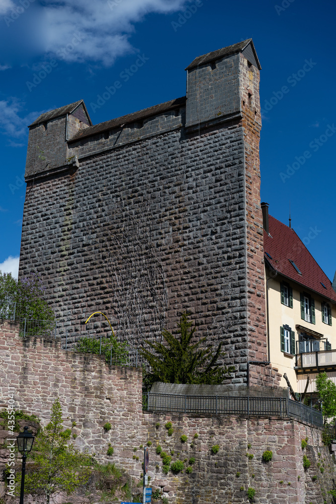 high wall of historic castle in black forest village