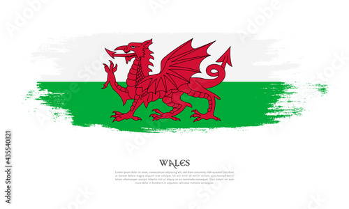 Wales flag brush concept. Flag of Wales grunge style banner background