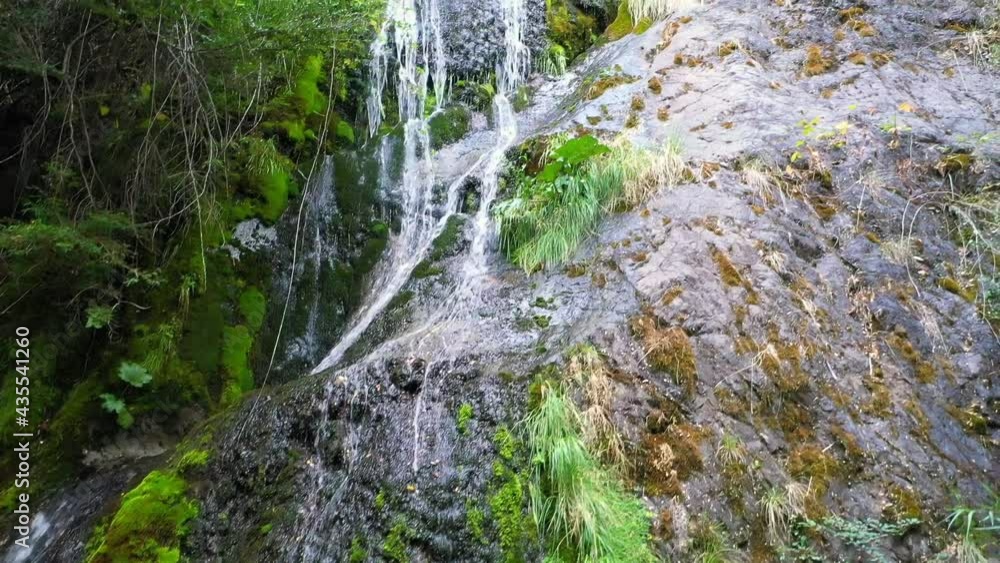 Drone films fine waterfall on the side of a rocky mountain that falls into the White River in Lago Puelo, Chubút, Patagonia Argentina. Drone films fine waterfall on the side of a rocky mountain that falls into the White River in Lago Puelo, Chubút, Patagonia Argentina.