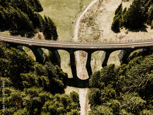 Historic railway viaduct situated in the forest near Telgart in Slovakia Aerial view. Chmarossky viadukt. Slovakia landscape. photo