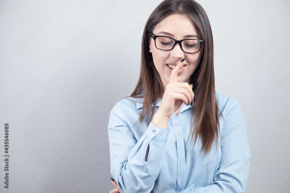 Portrait of beautiful woman with finger on lips Portrait of beautiful woman with finger on lips