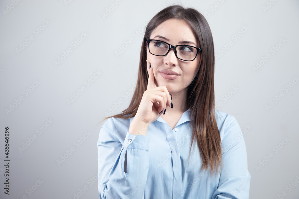 young woman thinking looks left