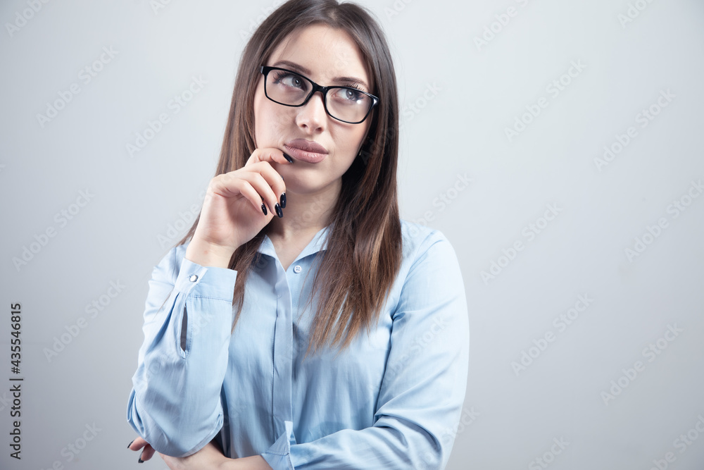 young woman thinking looks left