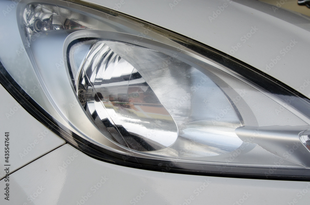 White car right-hand headlight