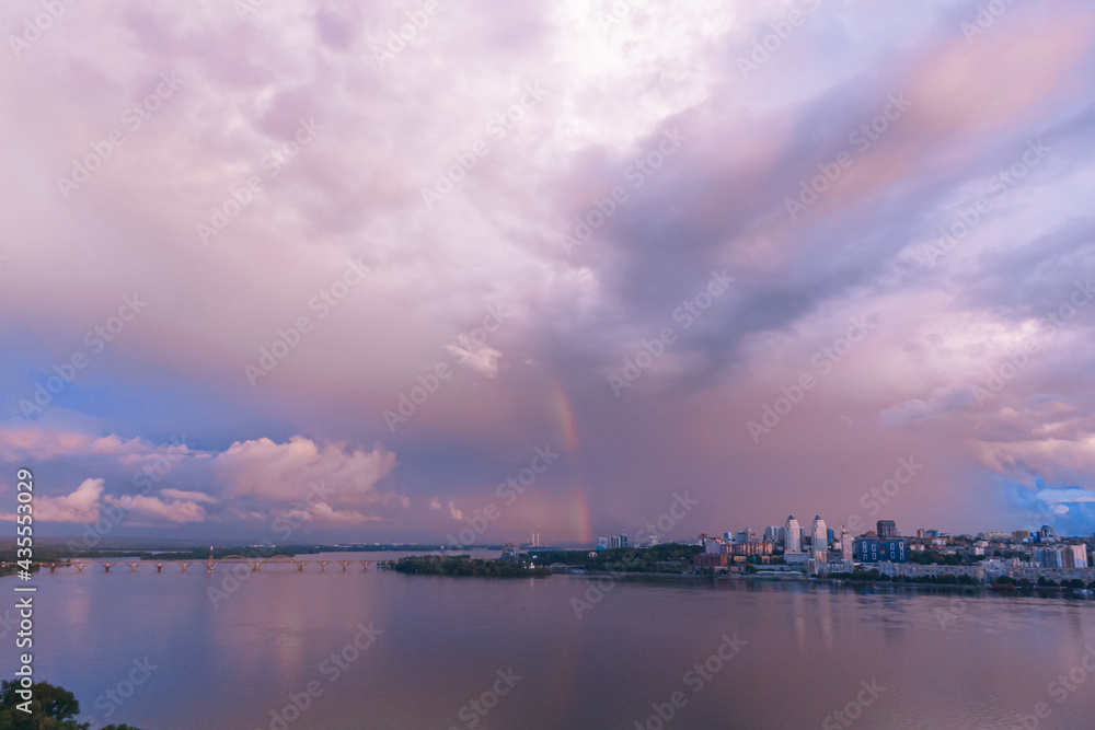 Rainbow is double in the most of photo. Beautiful double rainbow in the city after the rain. Photos taken from the drone.