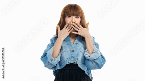 Asian woman is gagged by her hands, she surprised..