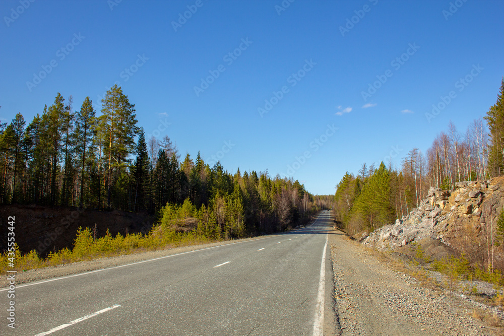 Fototapeta premium The road through beautiful places. Travel along the picturesque roads of the Urals and Siberia