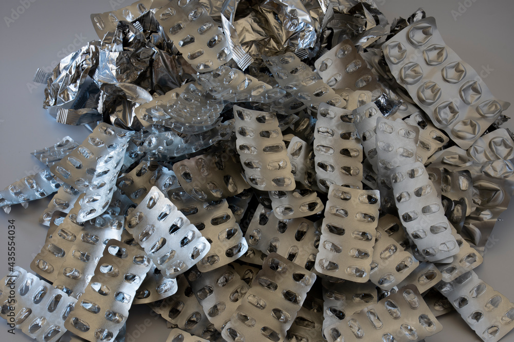 a stack of used and emptied medicine packaging. foils. Selective Focus. a stack of used and emptied medicine packaging. foils. Selective Focus.
