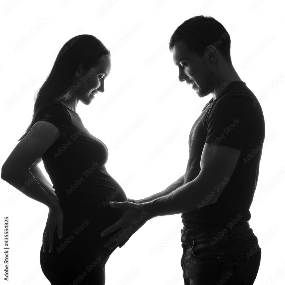 black and white silhouette portrait pregnant woman and man, long-awaited happy pregnancy, family, silhouette couple, ivf pregnancy