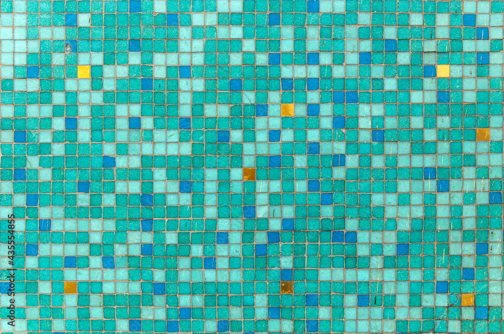 background of small squares in green color with red, blue and yellow spots background of small squares in green color with red, blue and yellow spots