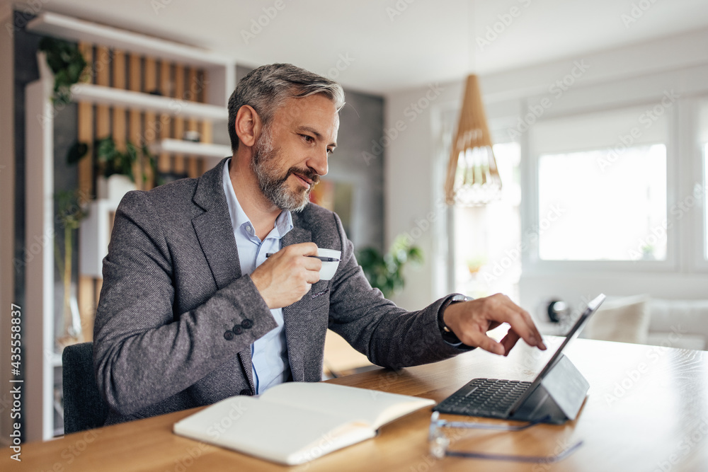 Adult man working hard from his home office, Adult man working hard from his home office,