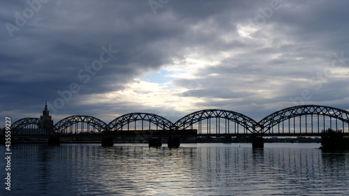 Spring, dawn over the Daugava on the background of the railway bridge © IHAR