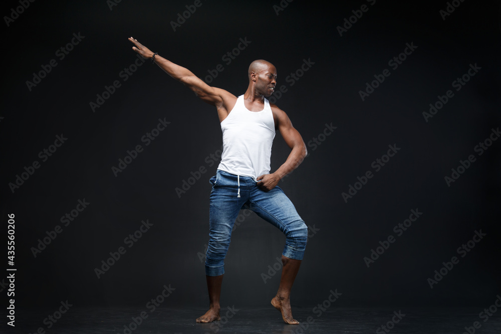 Dancing black man on a black background.