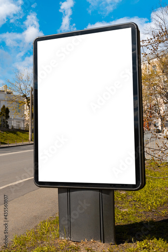 A blank billboard on the street for your advertising needs. mockup, vertical image.