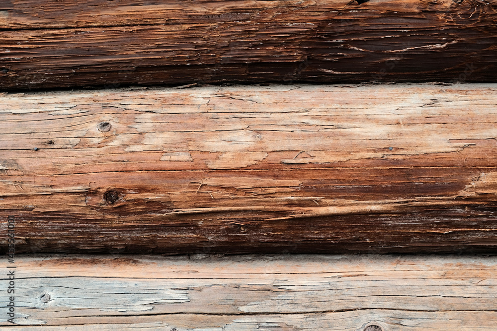 Old wooden beam with rustic house close-up Old wooden beam with rustic house close-up