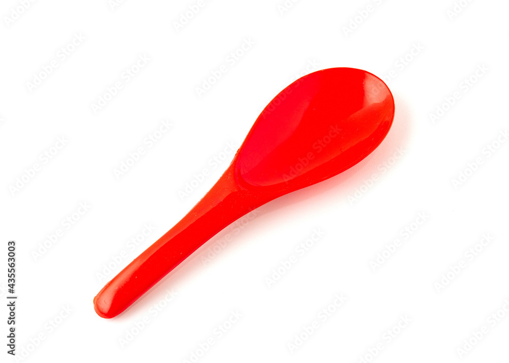 Red color of plastic spatula isolated on white background. Red color of plastic spatula isolated on white background.
