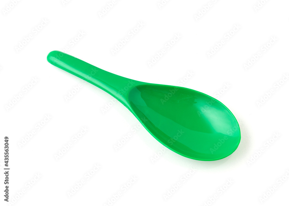 Green color of plastic spatula isolated on white background. Green color of plastic spatula isolated on white background.