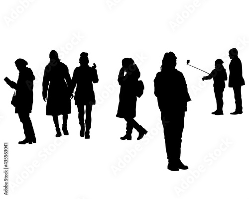 Man and women walking on street. Isolated silhouette on a white background