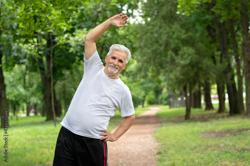 Senior man doing exercises in the park