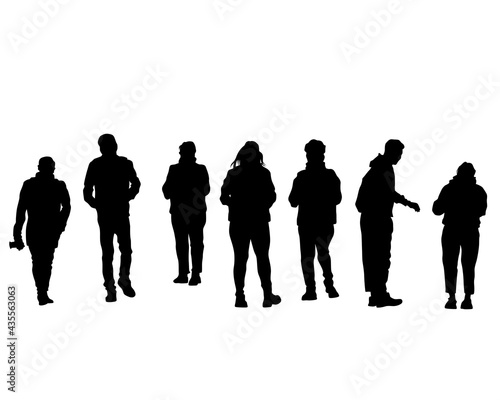 Man and women walking on street. Isolated silhouette on a white background