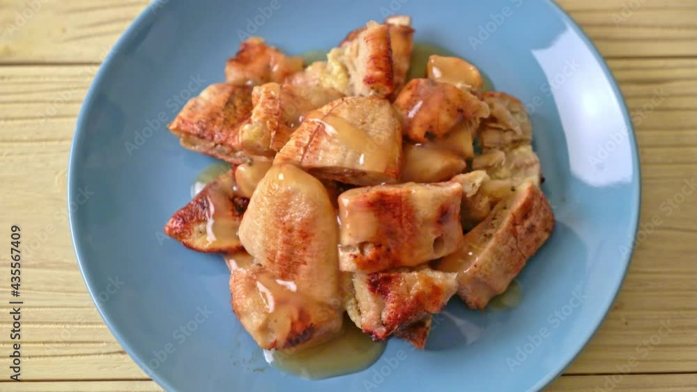 grilled bananas with coconut caramel sauce on plate grilled bananas with coconut caramel sauce on plate