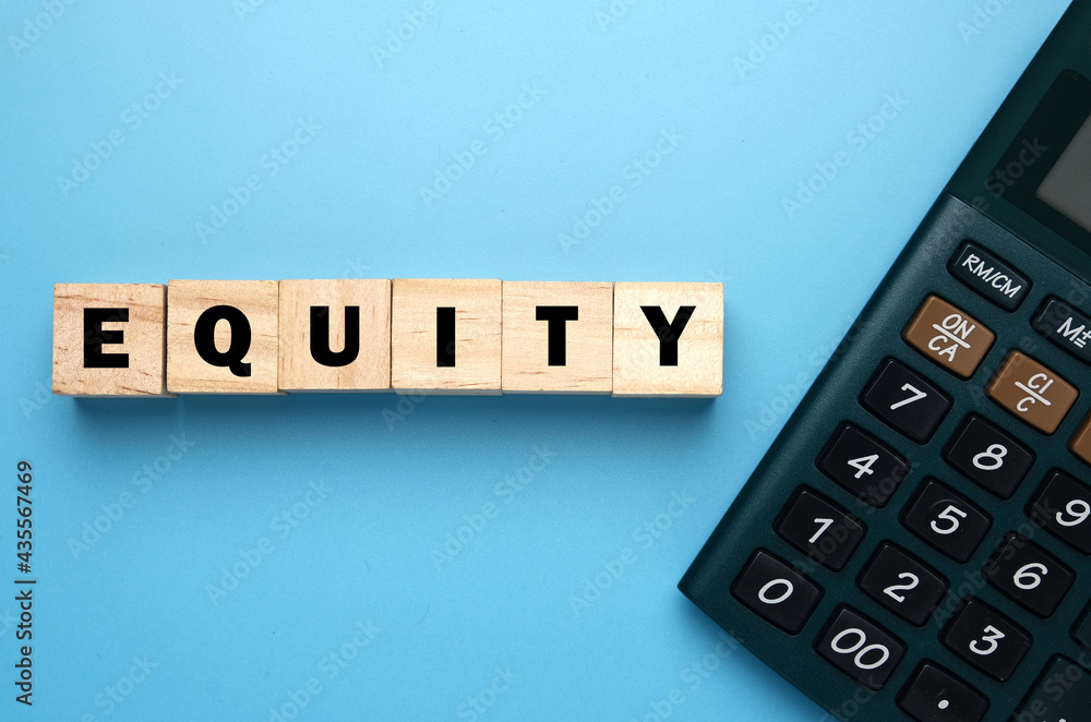 A picture of wooden block written Equity and calculator for financial equity concept. equity is ownership of assets that may have debts or other liabilities attached to them. A picture of wooden block written Equity and calculator for financial equity concept. equity is ownership of assets that may have debts or other liabilities attached to them.