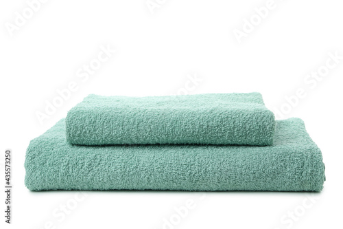 Folded clean towels isolated on white background