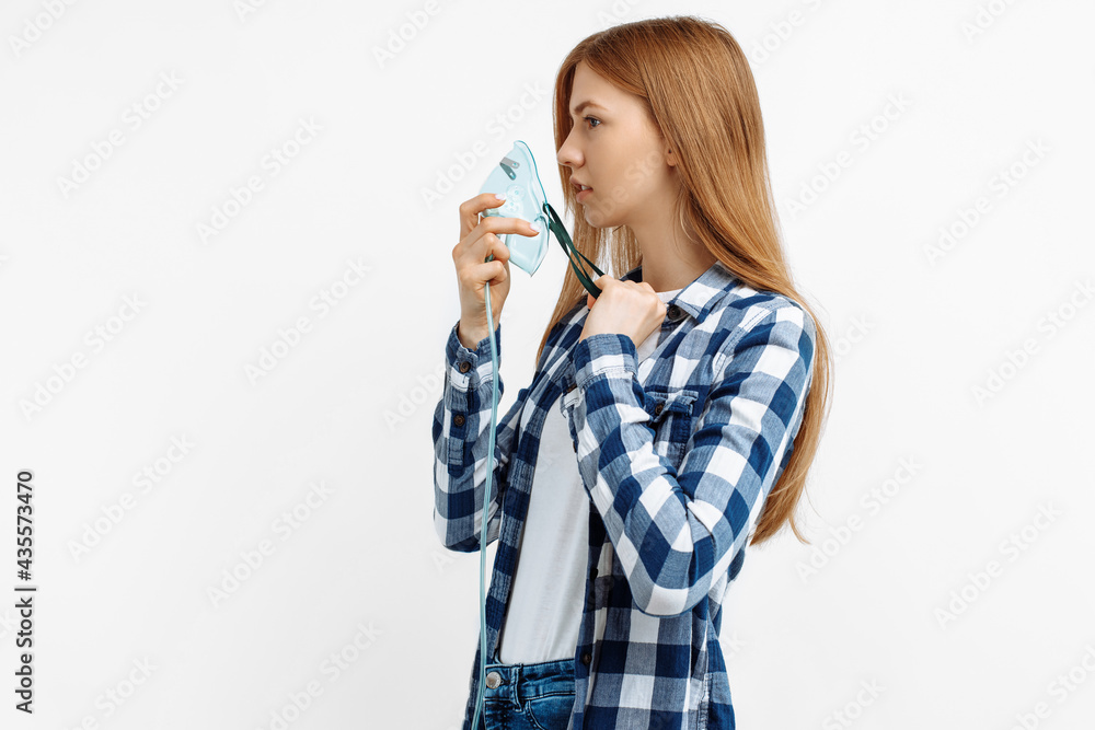 young female patient wearing oxygen mask on isolated white background young female patient wearing oxygen mask on isolated white background