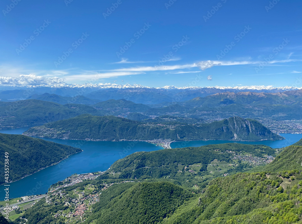 Panorama View from Top of Monte Genereso, Ticino, Switzerland. View to Lugano city, San Salvatore mountain and Lugano lake. Panorama View from Top of Monte Genereso, Ticino, Switzerland. View to Lugano city, San Salvatore mountain and Lugano lake.