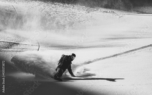 Tableau sur toile Snowboarder rides on fresh snow