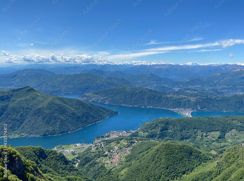 Panorama View from Top of Monte Genereso, Ticino, Switzerland. View to Lugano city, San Salvatore mountain and Lugano lake. 