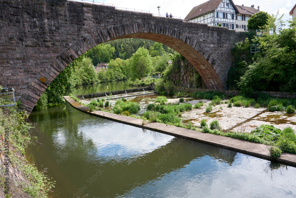 imposing stone bridge over a beautiful river imposing stone bridge over a beautiful river