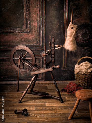 Fotografija Antique spinning wheel in old room