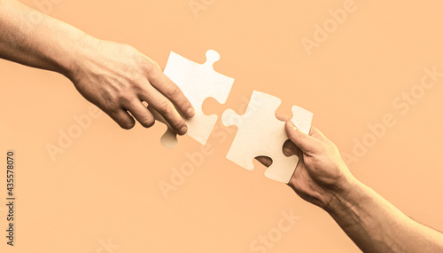 Hand connecting jigsaw puzzle. Business solutions, success and strategy concept