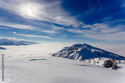 Winter mountains low clouds and sun © Roman