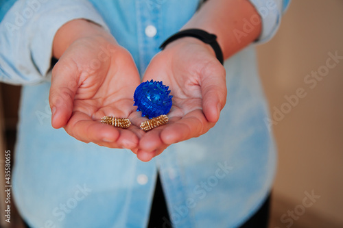 Person holding Colorful Physical therapy balls. Sujok acupressure therapy concept. Sujok balls in the persons hand. 