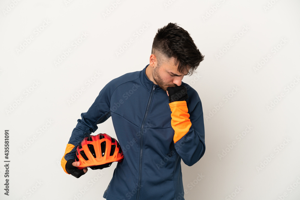 Young cyclist man isolated on white background having doubts - obrazy, fototapety, plakaty 