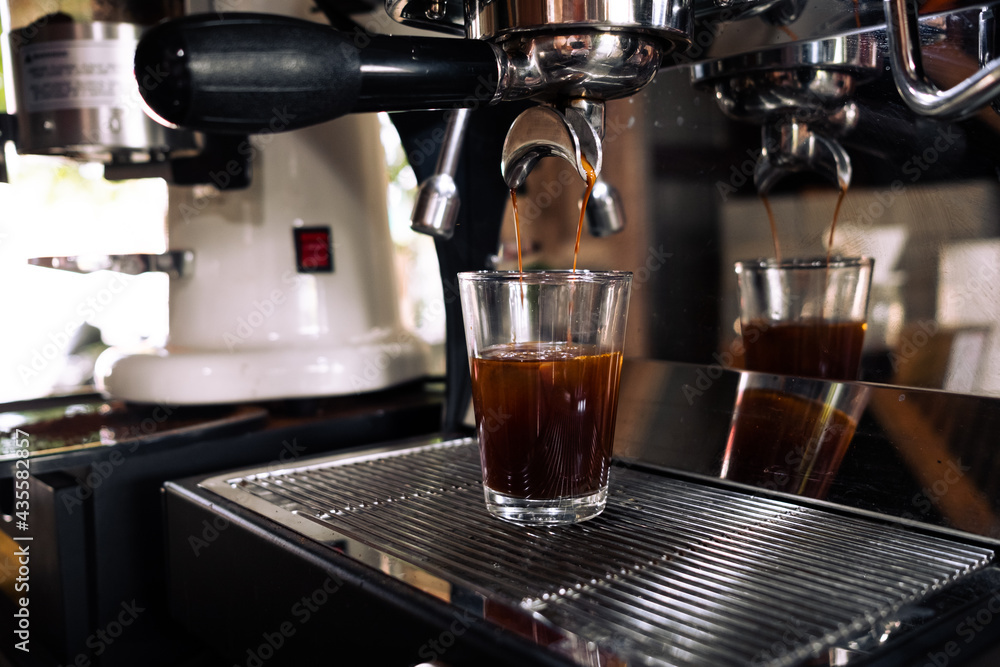 Fresh espresso shot pouring out of machine. Fresh espresso shot pouring out of machine.