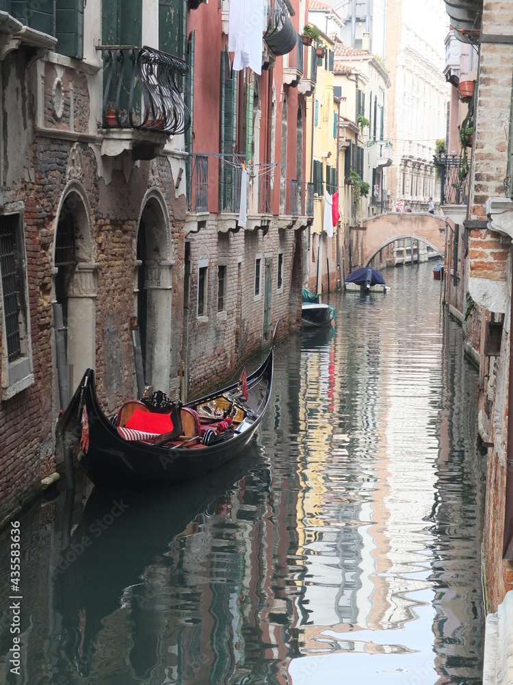 Gondola in a Venice Canal in Italy with Reflections