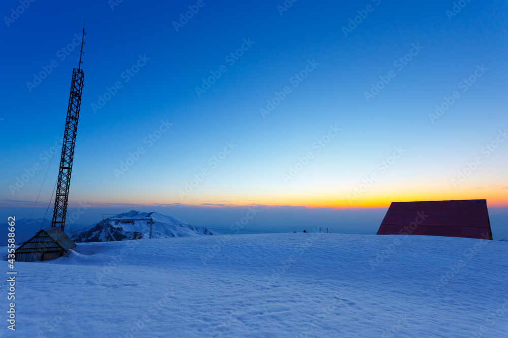 Meteo station in the winter sunset in the mountains