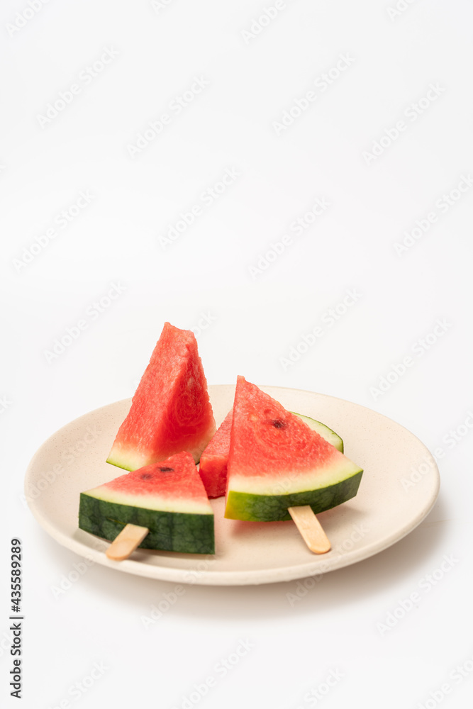 There is watermelon ice cream on the plate There is watermelon ice cream on the plate