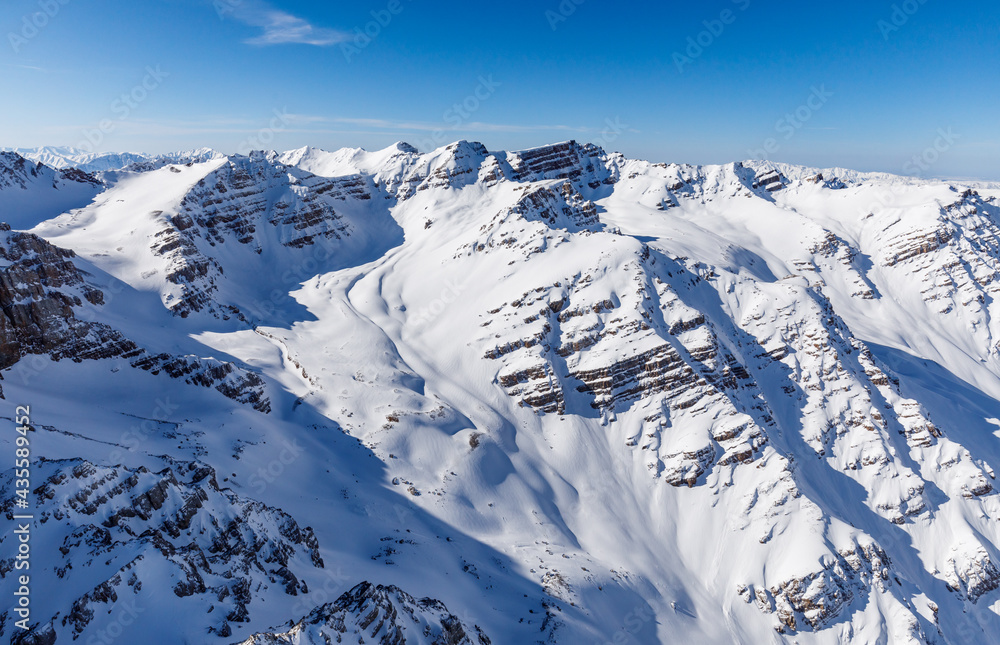 High snowy mountains in winter and blue skies